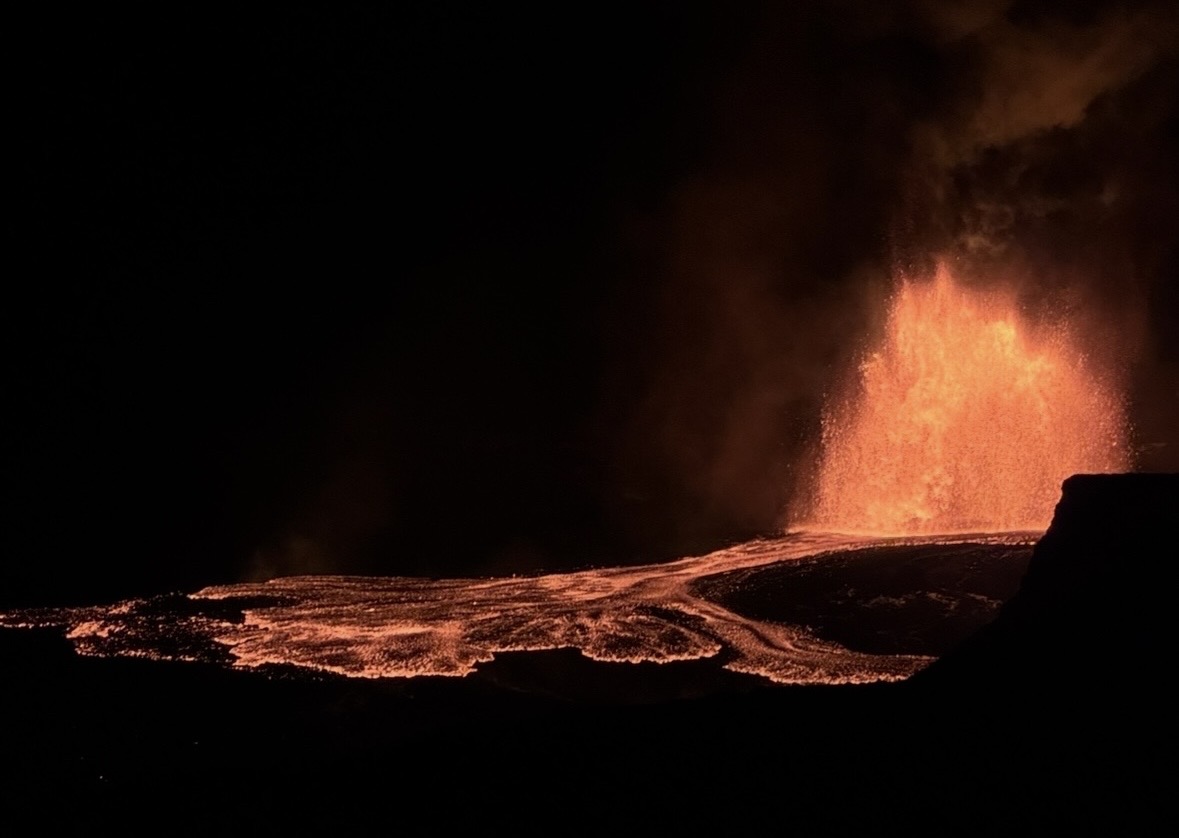 Rafael’s photograph of a Kīlauea lava fountain and glowing lava flows at night